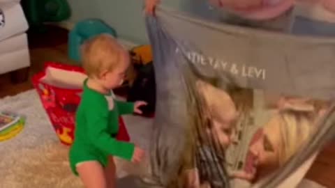 Baby has the sweetest reaction to gift blanket from auntie ok