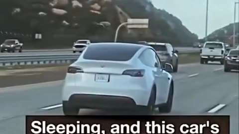 A Tesla driver was filmed sleeping at the wheel while