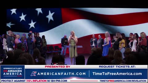 Julia Flynn sings the national anthem