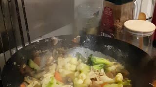 Making chicken stirfry. With satay sauce