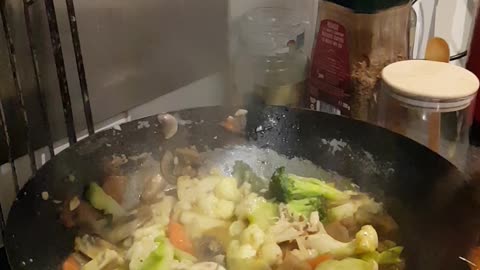 Making chicken stirfry. With satay sauce