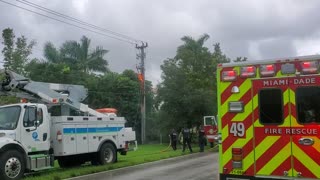 Fire Fighters Trying To Put Out Fire After Lightning Hit Pole