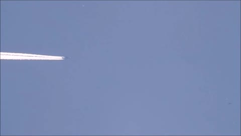 Slow Motion Of Strange Object Flying In Plane Zoom-in