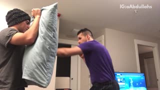 Guy punches pillow boxing training kicks friend in crotch