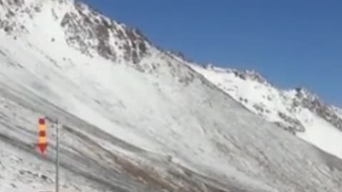 Passing the scenery of snow mountain