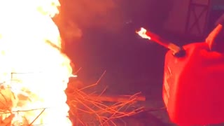 Girl pours gas onto fire gas tank slightly on fire after