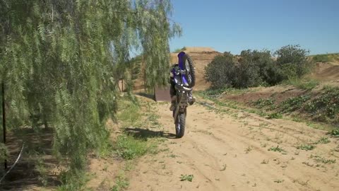 Jarryd Mcneil and his crazy dog Rooga riding dirt bike in slow motion at the Mcneil Farm.
