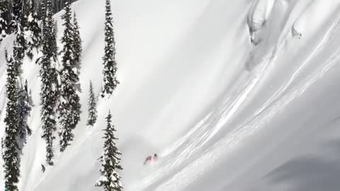 Both snowboard and ski cliff drops