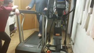 Guy black long sleeve shirt runs on treadmill falls