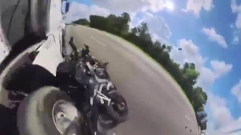 DUDE ON A MOTORCYCLE LANE SPLITS AND CAUSES AN ACCIDENT THEN GETS HIT BY A TRUCK