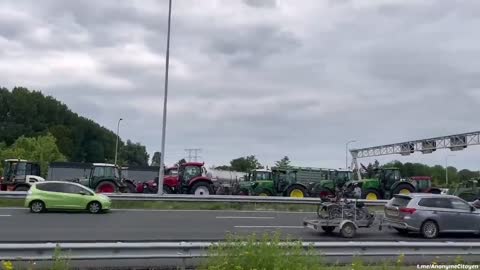 Dutch farmers protest energy policies, form convoy, leave bale's of hay on road