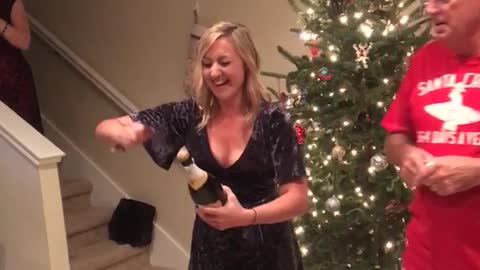 Blonde girl knifes cork off bottle hits friend