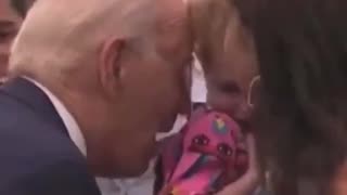 Biden nibbles on terrified child again