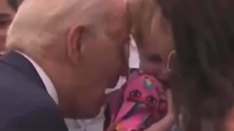 Biden nibbles on terrified child again
