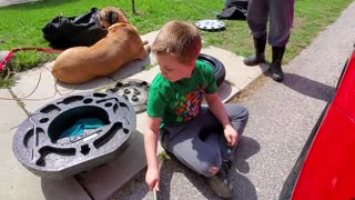 How to change a flat tire, by a 9 year old - sort of.