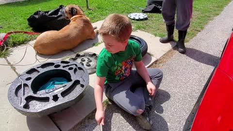 How to change a flat tire, by a 9 year old - sort of.