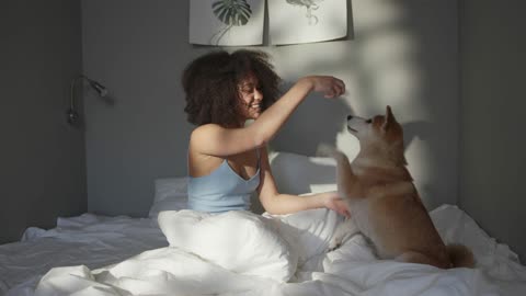 A Woman Teasing Her Dog