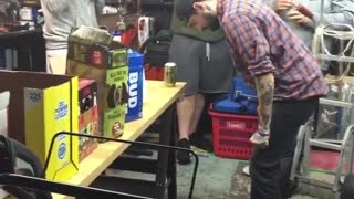 Guy hits head on table smashing can