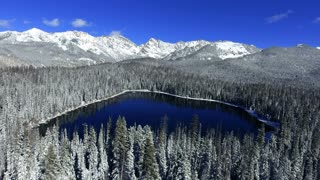 Aerial Flight Over A Wintry Snow Covered Lake