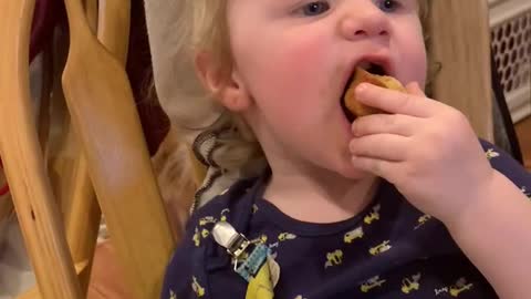 Great grandson eating mini bites