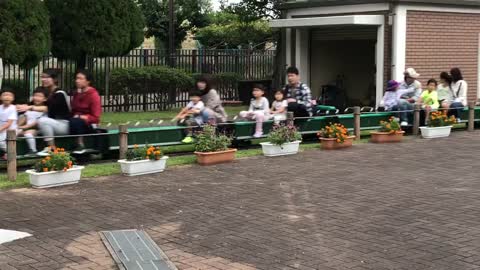 Japanese Children riding a Playground Train