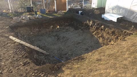 Day 9 of PyraPOD4 Grande-17 Backyard DIY: Collin finished digging, I got the felt and pond liner