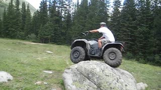 Guy Flips ATV Over Trying To Ride Over Boulder