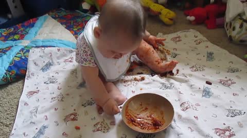 Baby Led Weaning Six Month Old eating chili