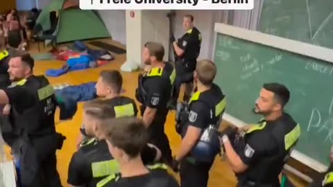 German police line up to prepare to forcibly removed a Palestine encampment