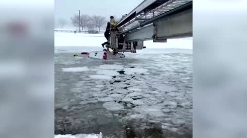 U.S. firefighters rescue civilians from icy river
