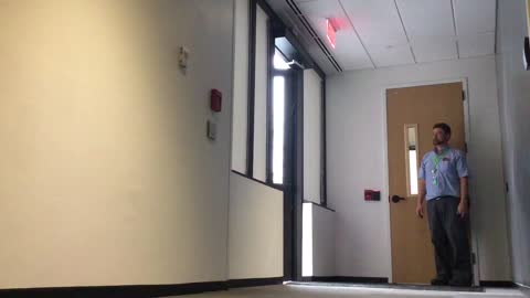 An ADA door opens when walking past it