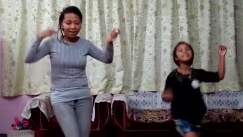 daughter is imitating the dance steps of mom