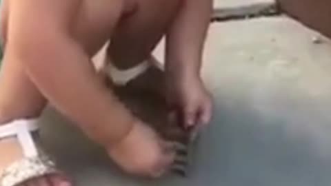 Funny Kid Trying To Sit On Her Toy Chair