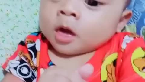 Cute baby trying HARD to speak with Big smile