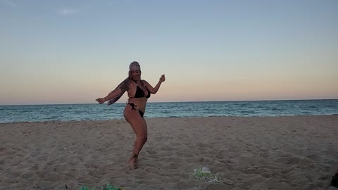 Sexy Woman Dancing On The Beach