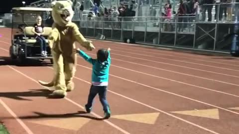 Toddler Shows Off Dance Moves In Front Of A Crowded Stadium