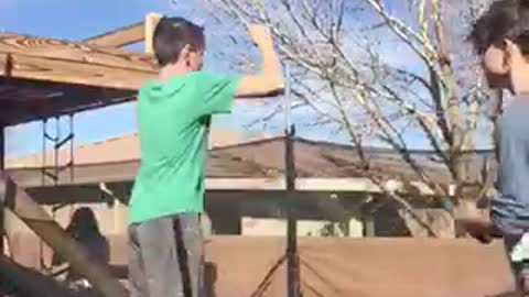 Kid green shirt trampoline backflip hit heads trampoline fail