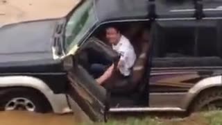 Idiot drives across river