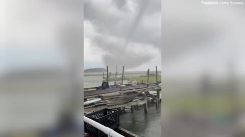 waterspout sweeps across island destroying several homes