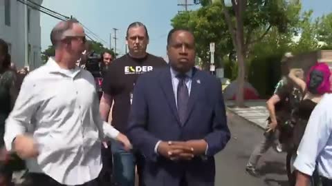 Larry Elder & entourage accosted attacked by gorilla-masked Antifa.