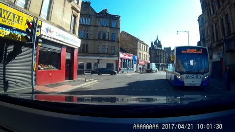 Near miss, Father and Son narrowly miss getting hit by a Bus.