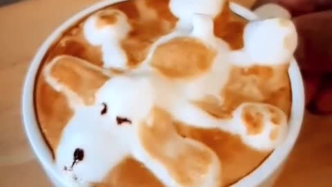 a cup of coffee with puppy-image-of-foam-on-top