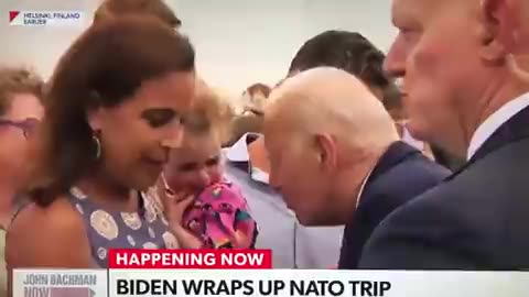 What the Heck? President Joe Biden is licking a Little Kid?
