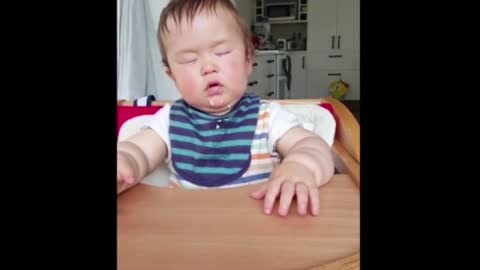 Baby literally falls asleep while eating snack