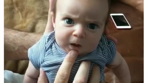 Watch this funny baby dads messing with baby real funny try not to laugh