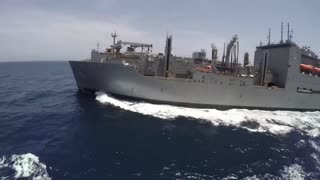 Navy ships supply at sea