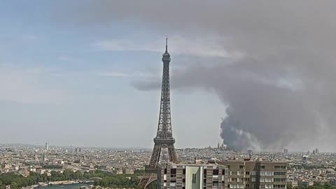 Smoke drifts over Paris after fire in suburban warehouse