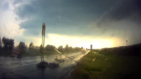 Speeding Vehicle Almost Crashed Into a Sign on the Road as It Rains