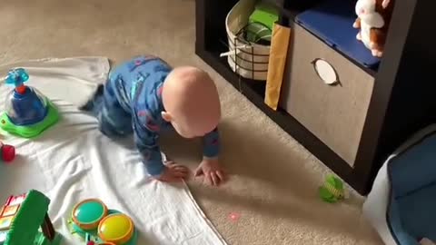 Baby crawls for laser pointer for cats. Ultimate parenting hack 😆