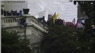 Capitol Police push Patriot off ledge.